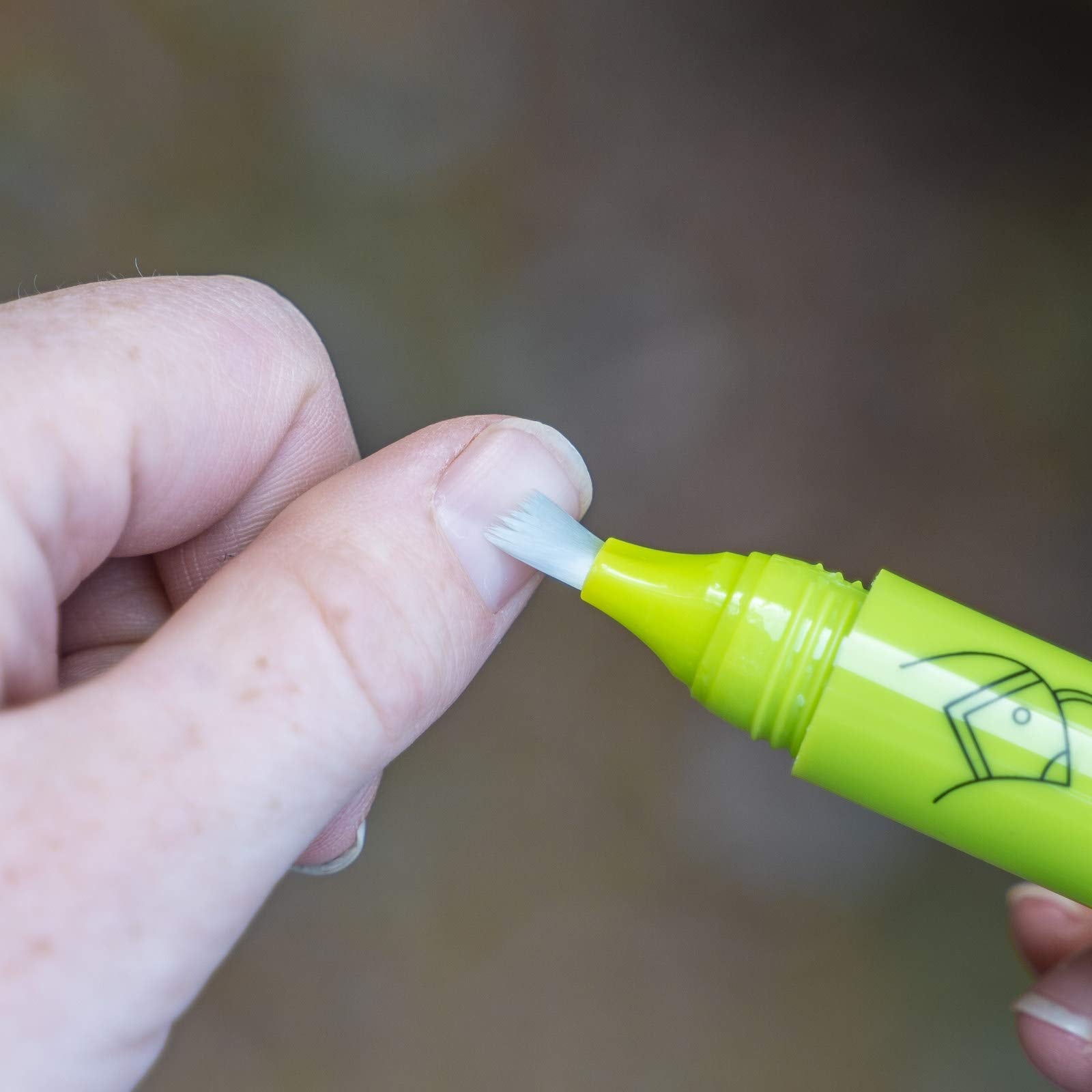 Nail Quail applied clear finish on fingernails, invisible protection and bitter deterrent