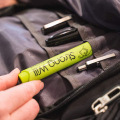 Nail Quail pen held in hand to show compact scale and quick reapplication convenience