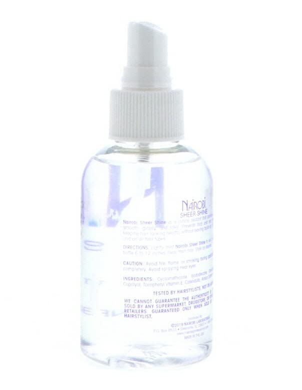 Hand applying Nairobi sheer shine to mid-lengths demonstrating fast absorption and smoothing