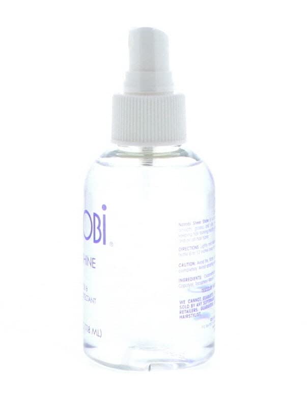 Nairobi sheer shine serum drop on fingertip showing lightweight texture and spreadability