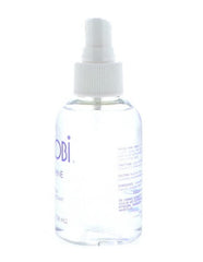 Nairobi sheer shine serum drop on fingertip showing lightweight texture and spreadability