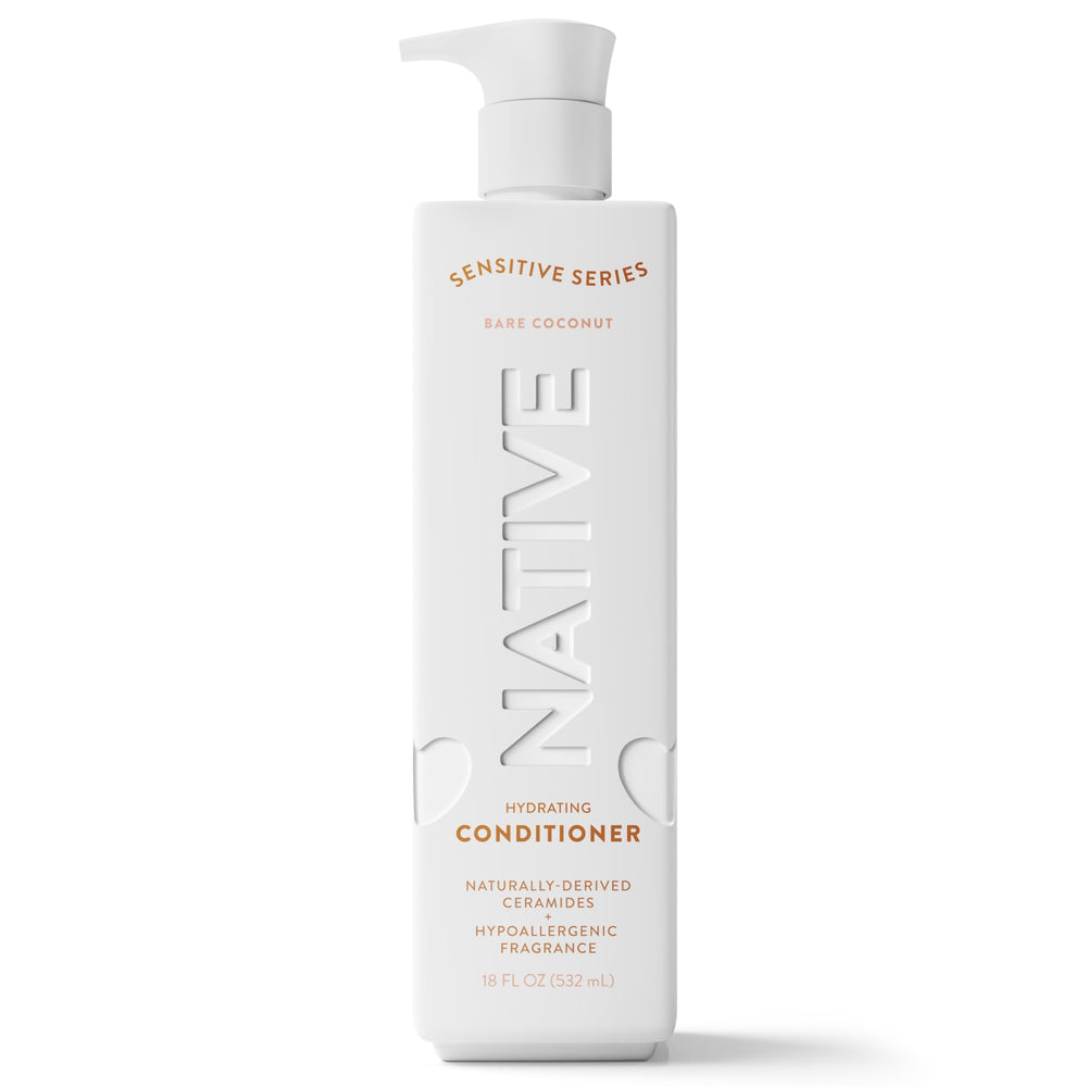Native hands applying conditioner to hair mid-lengths demonstrating frizz control