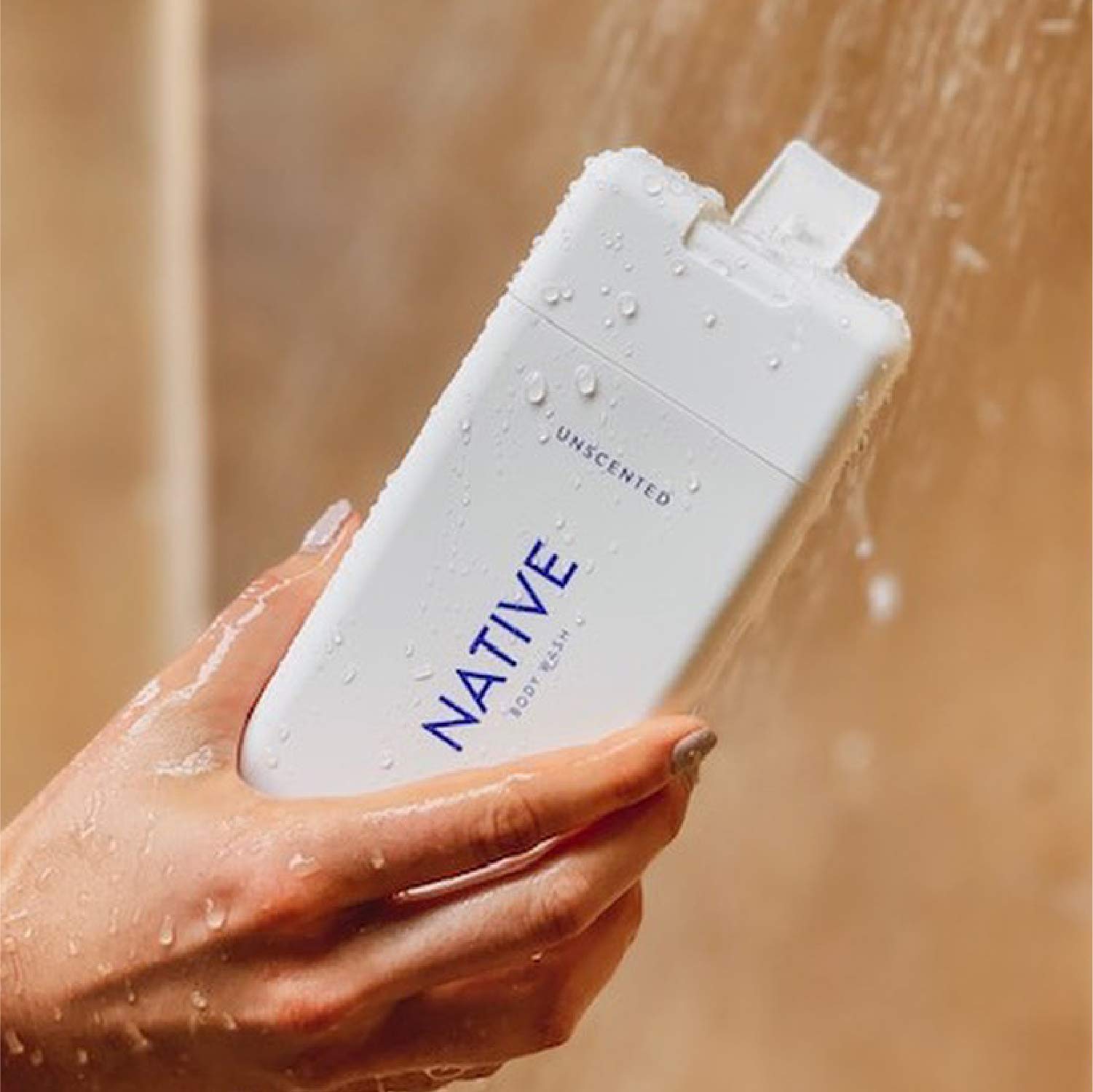 Native body wash in shower hands producing rich lather for clean skin