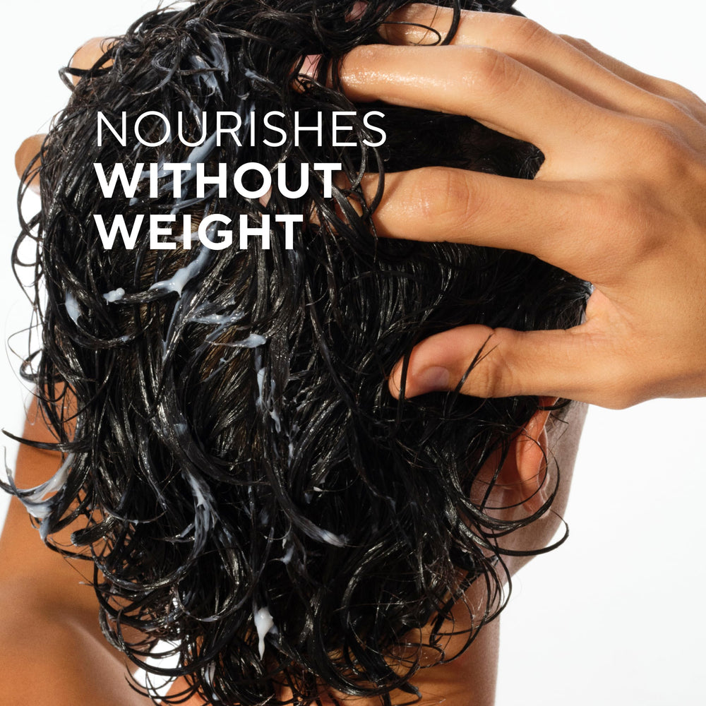Native conditioner cream texture on fingers showing slip and detangling benefit