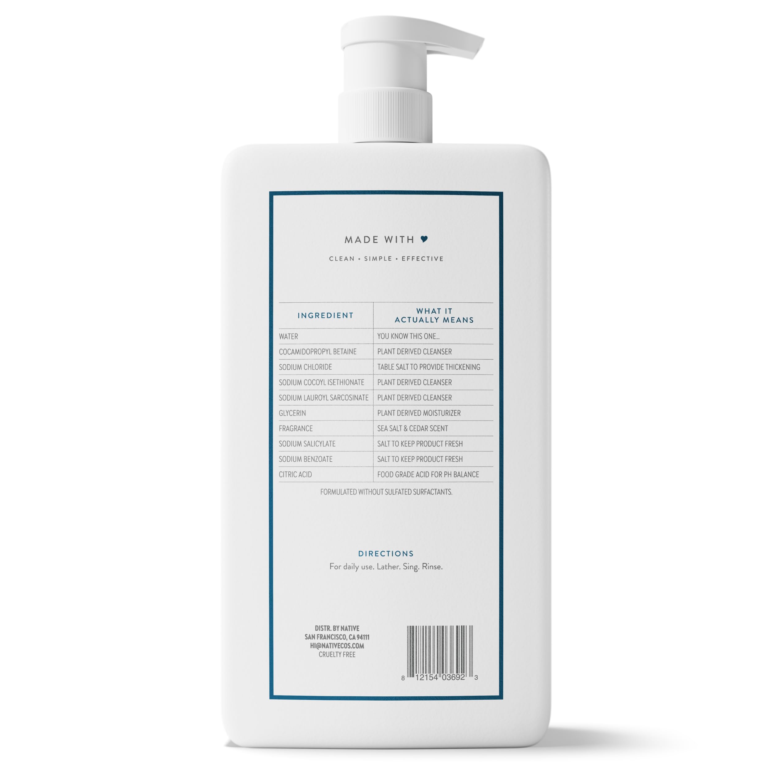 Visual of sea salt crystals and cedar wood near bottle, communicating fresh natural scent