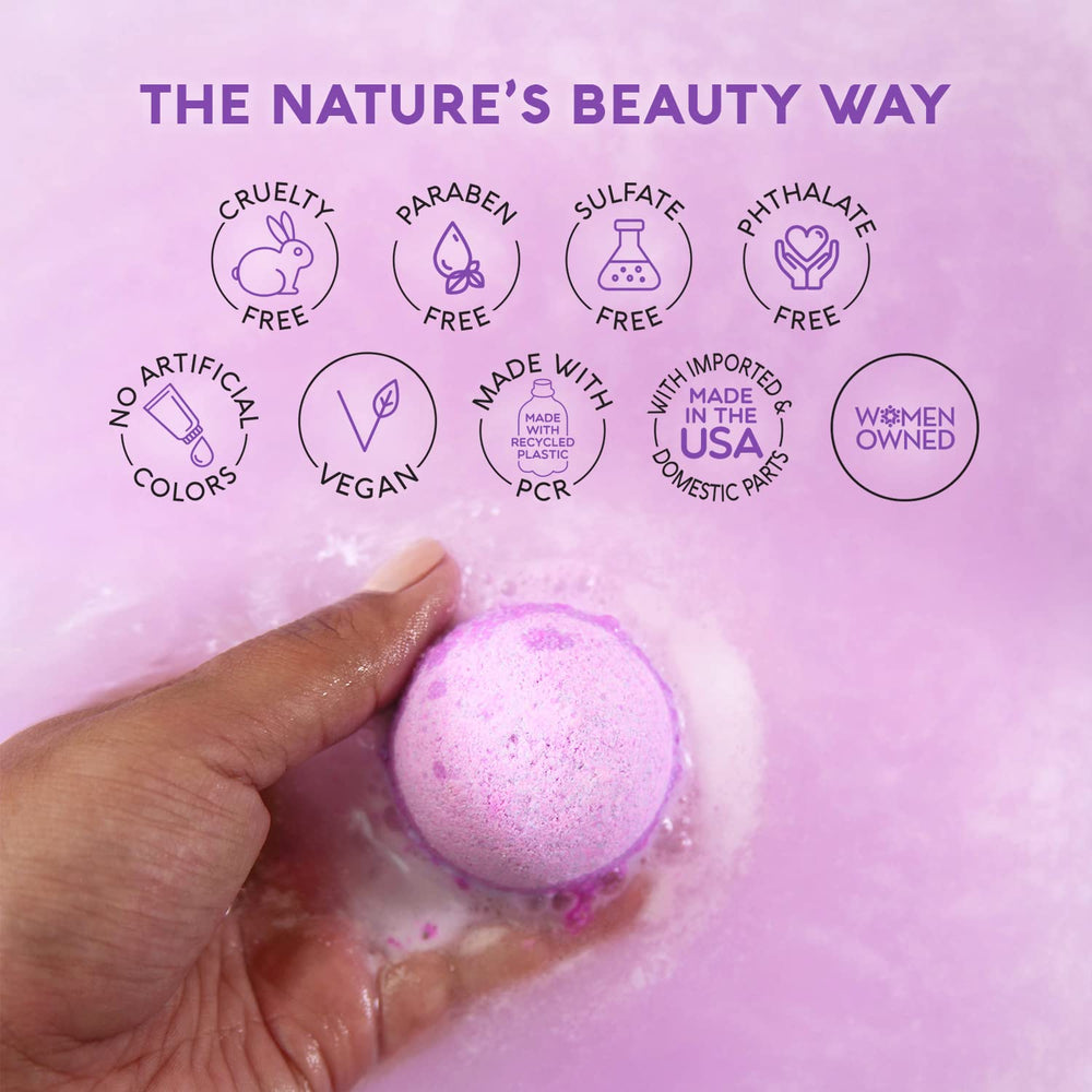 Nature's Beauty hand holding bath bomb to show size and easy-use benefit