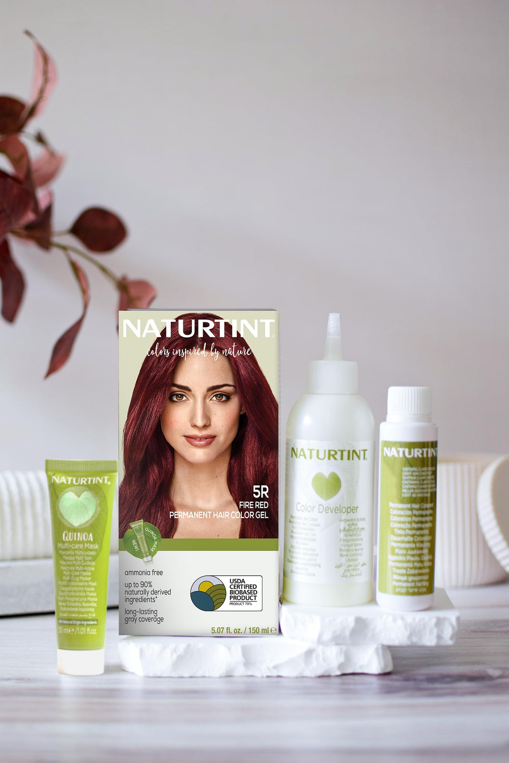 Naturtint color swatch on hair sample illustrating Fire Red tone