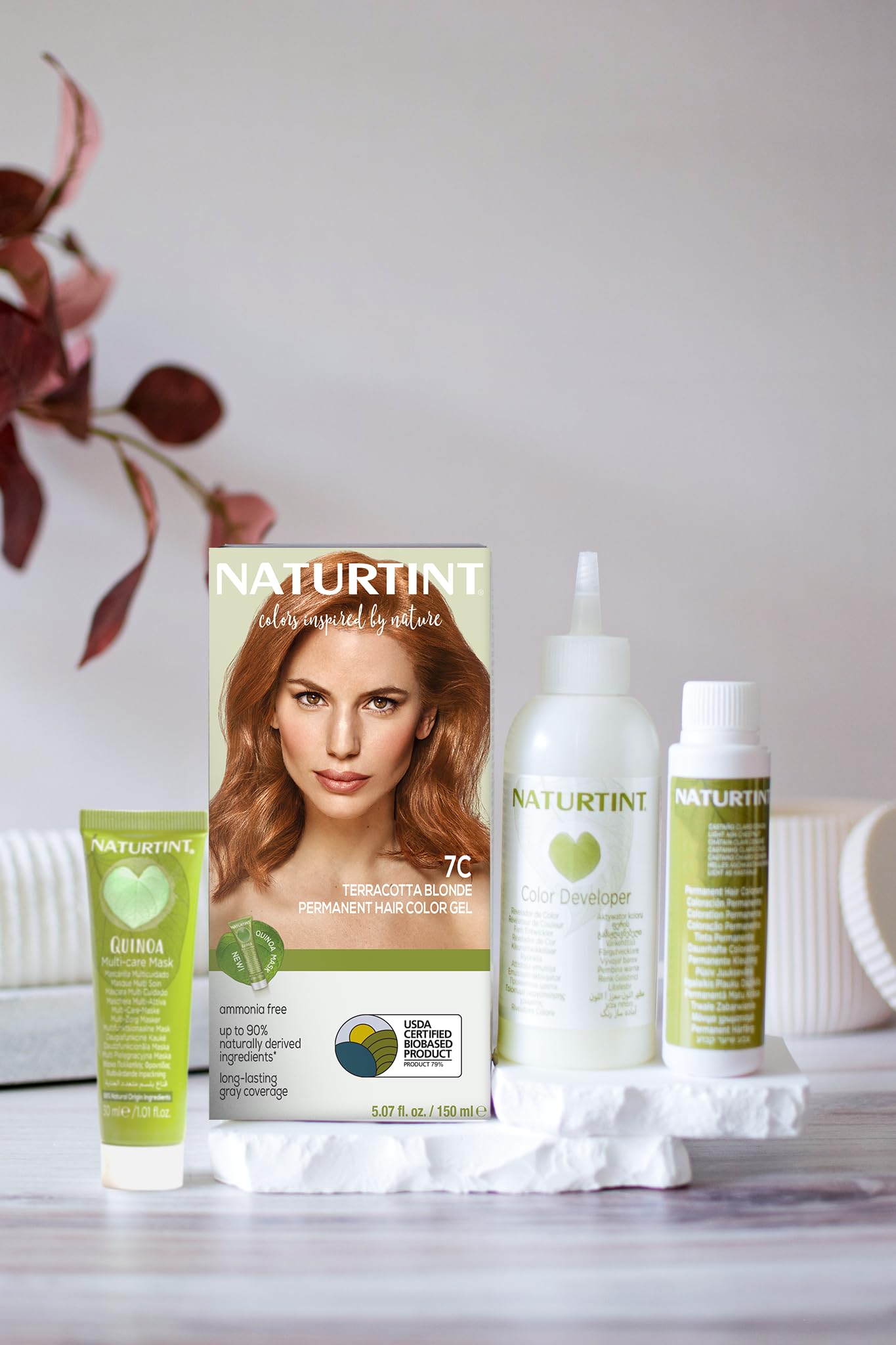 Naturtint applying product to hair strands for even color and coverage