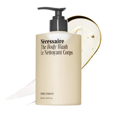Nécessaire front packaging showing compact travel bottle and clear branding for convenience