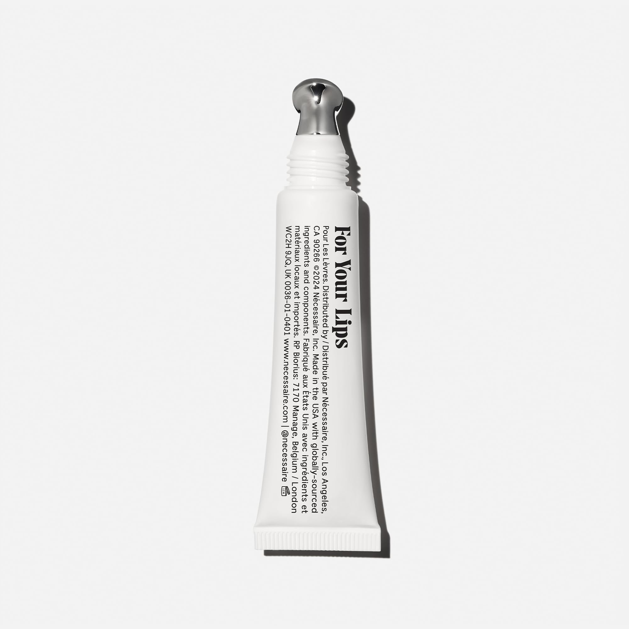 Nécessaire open stick close-up revealing smooth balm texture for glide