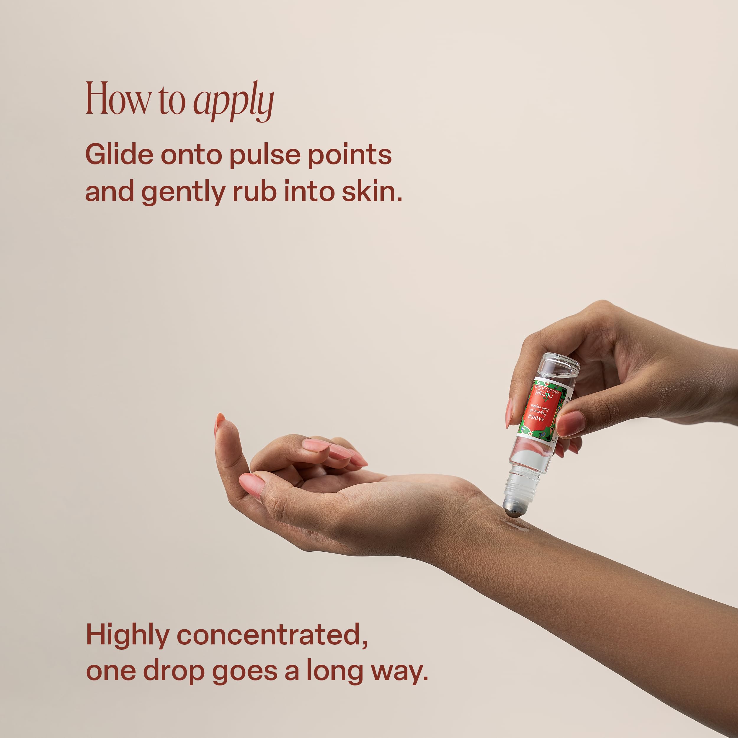 Nemat International applying amber oil on wrist to demonstrate gentle, long-lasting scent