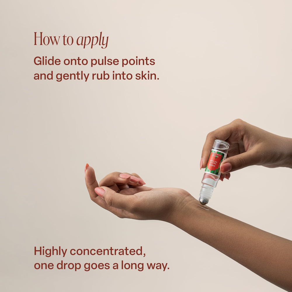 Nemat International applying amber oil on wrist to demonstrate gentle, long-lasting scent