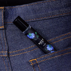 NEST New York Indigo held in hand to show 8 mL scale and easy pocketable convenience