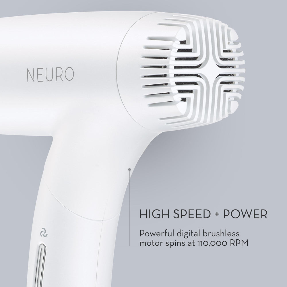 Hand holding Neuro dryer to show scale and lightweight handling benefit