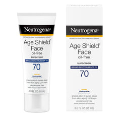 Neutrogena Age Shield tube beside keys showing travel-friendly size