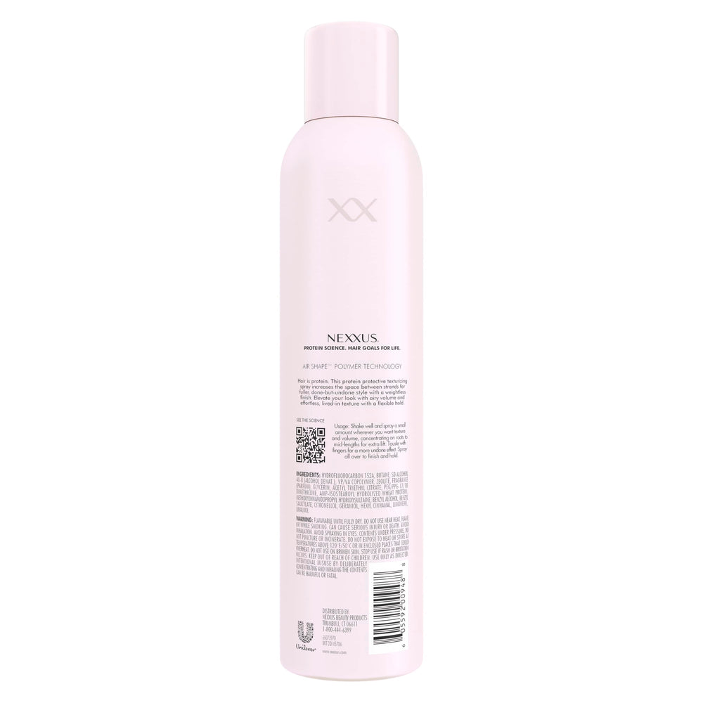 Nexxus spray nozzle detail illustrating controlled mist for even application