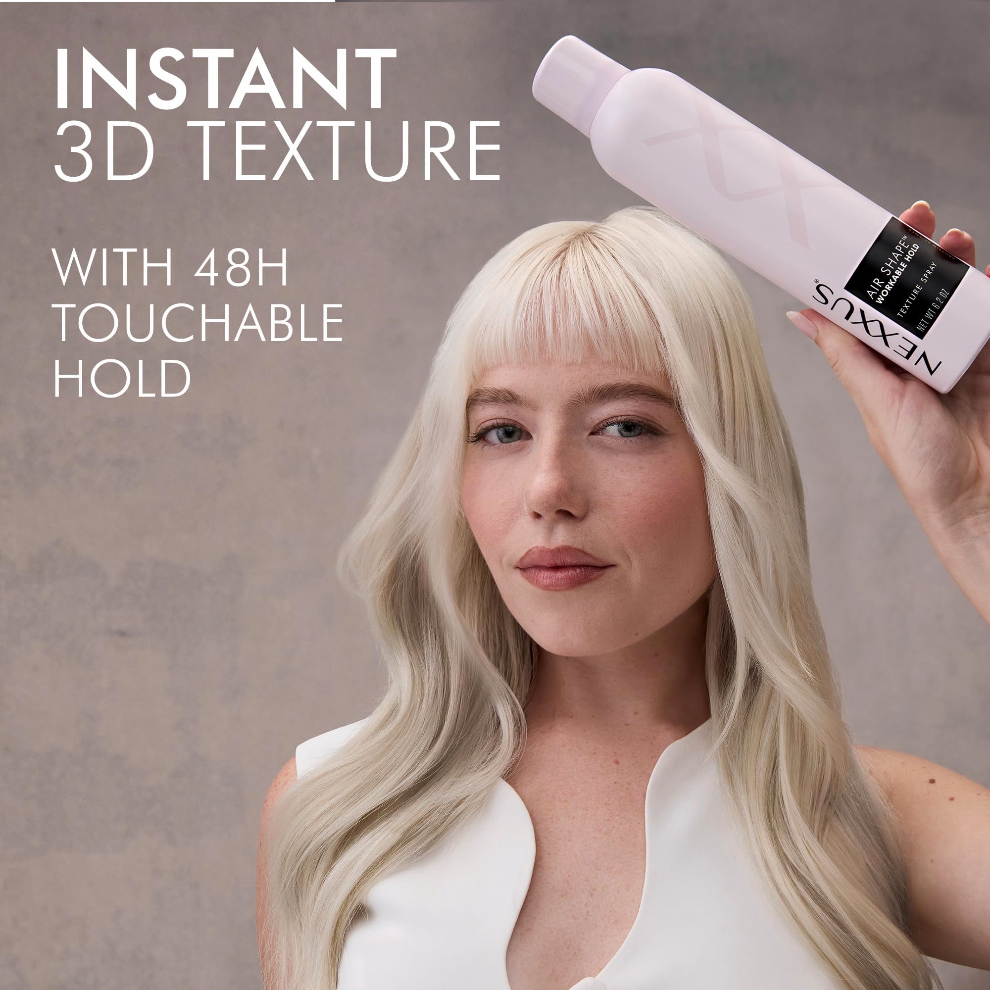 Nexxus spray in use on model creating instant 3D texture and lift
