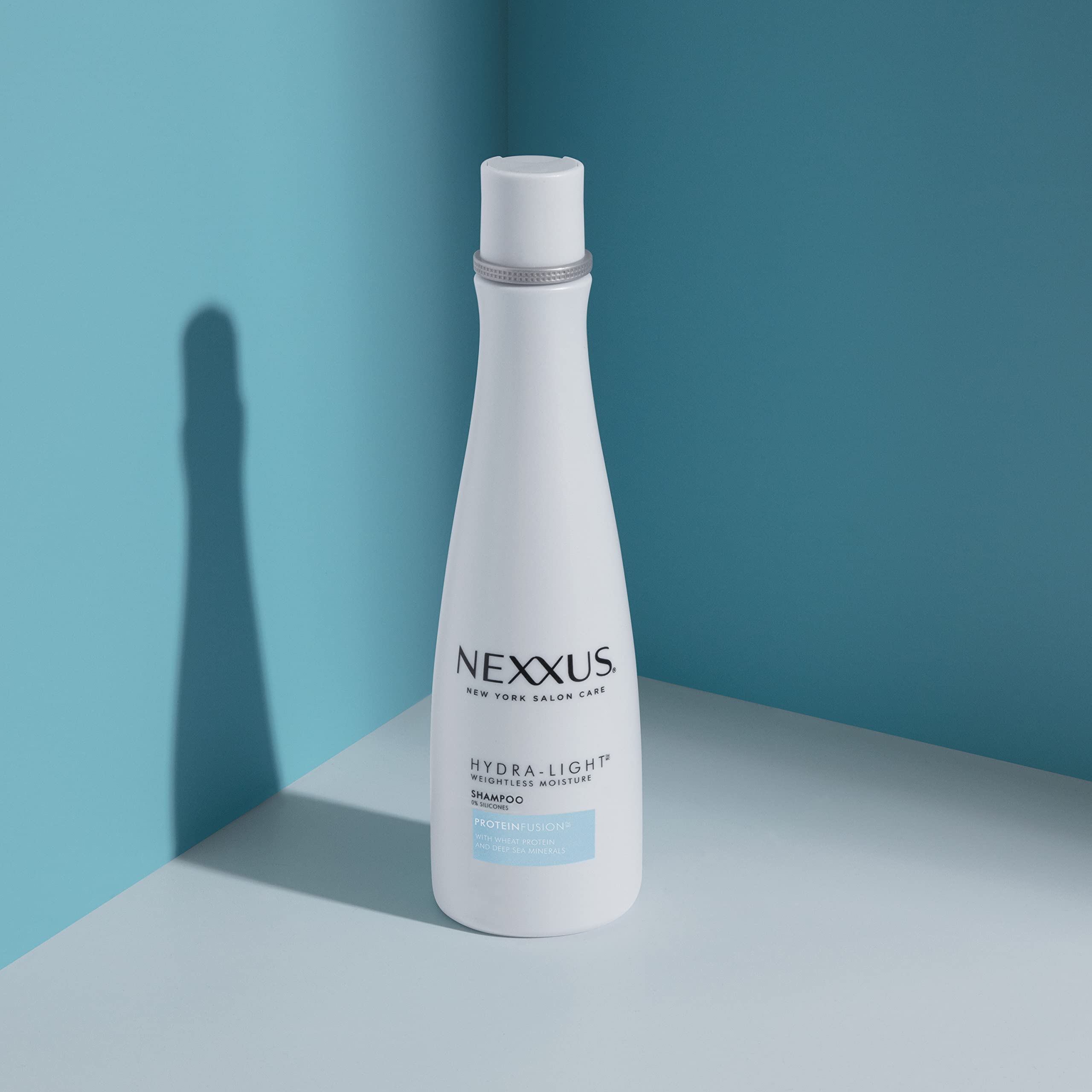Nexxus hydra-light on hand measuring squeeze showing product amount control