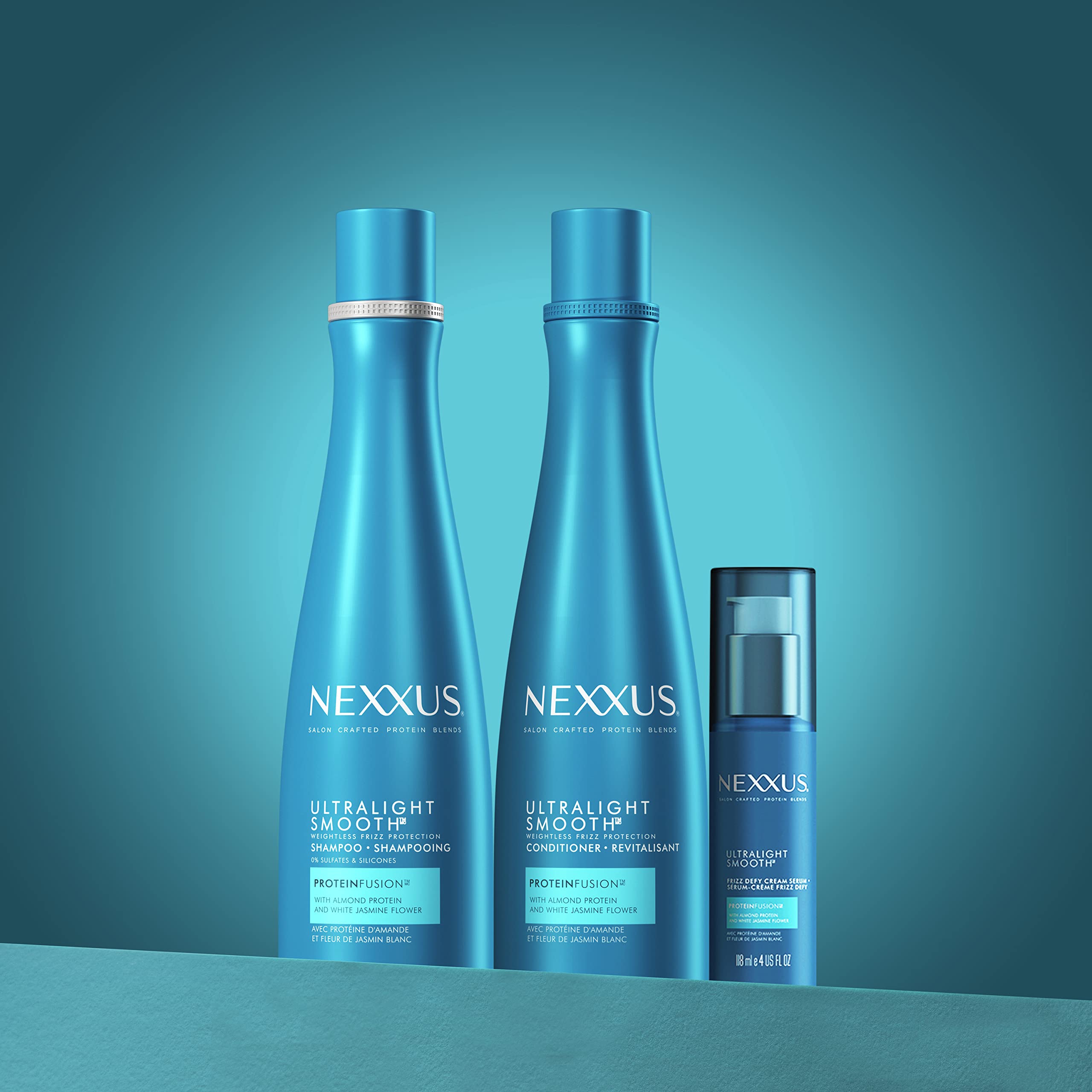 Nexxus bottle next to hand for size comparison and travel-friendly benefit