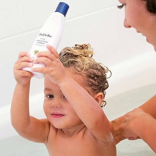 Noodle & Boo bottle held in hand demonstrating 16 oz size and long-lasting supply