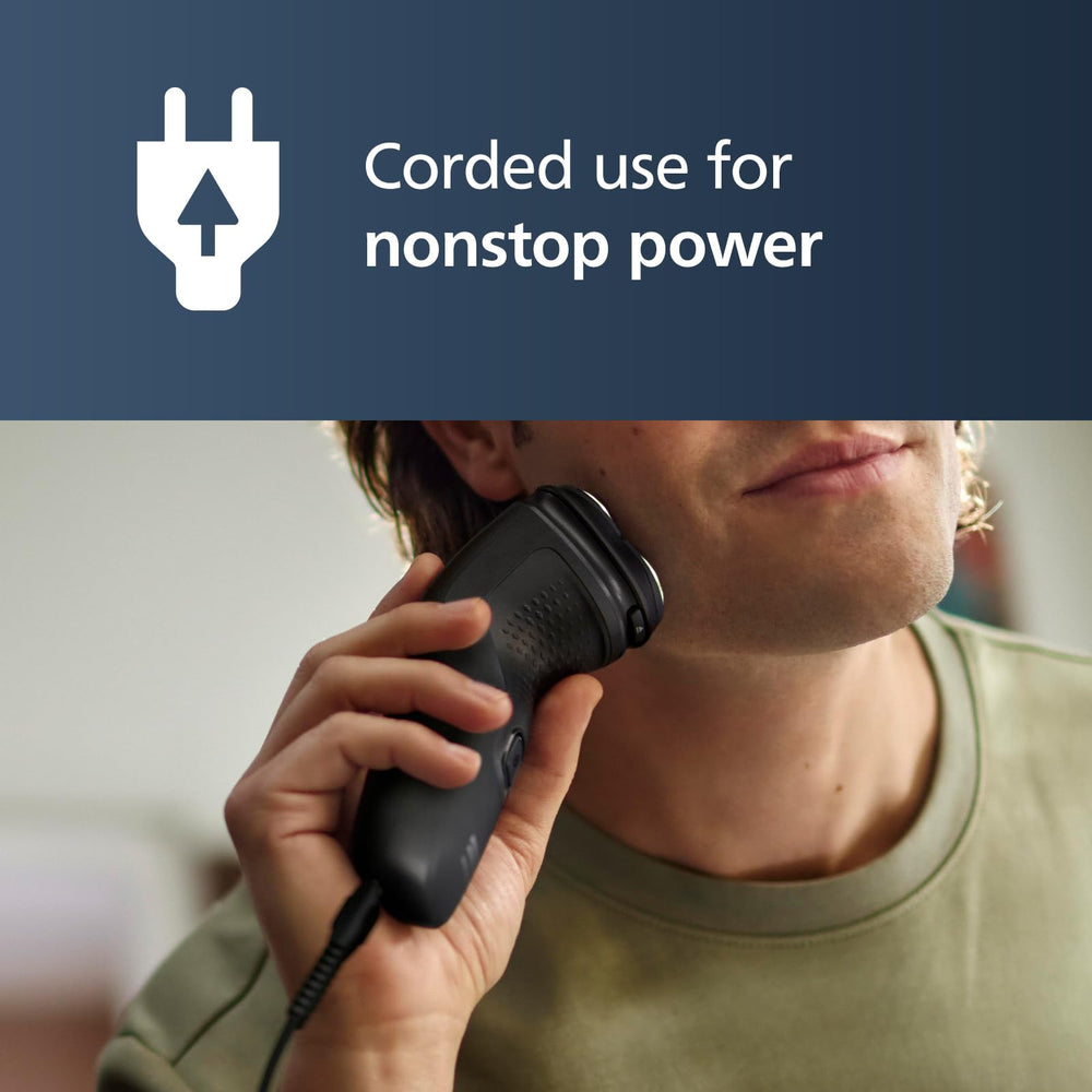 Norelco 1100 plugged in and in use demonstrating corded power and steady performance
