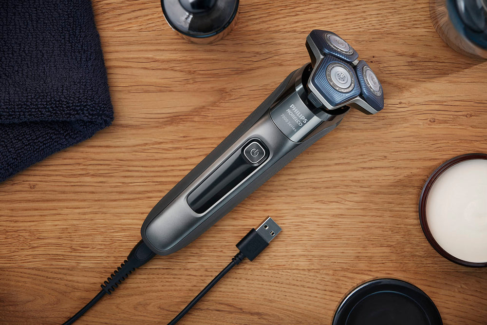 Norelco 7200 accessories laid out with protective cap and cleaning brush