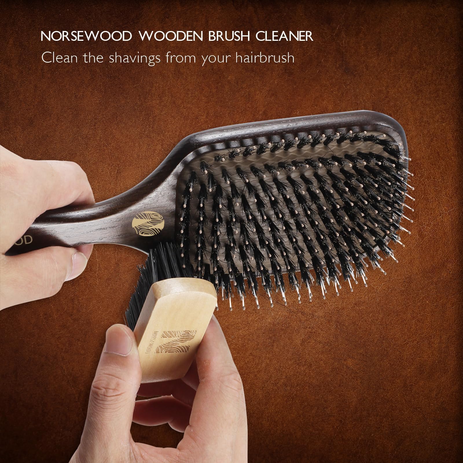 Norsewood brush held in hand to show scale and ease of use for daily grooming