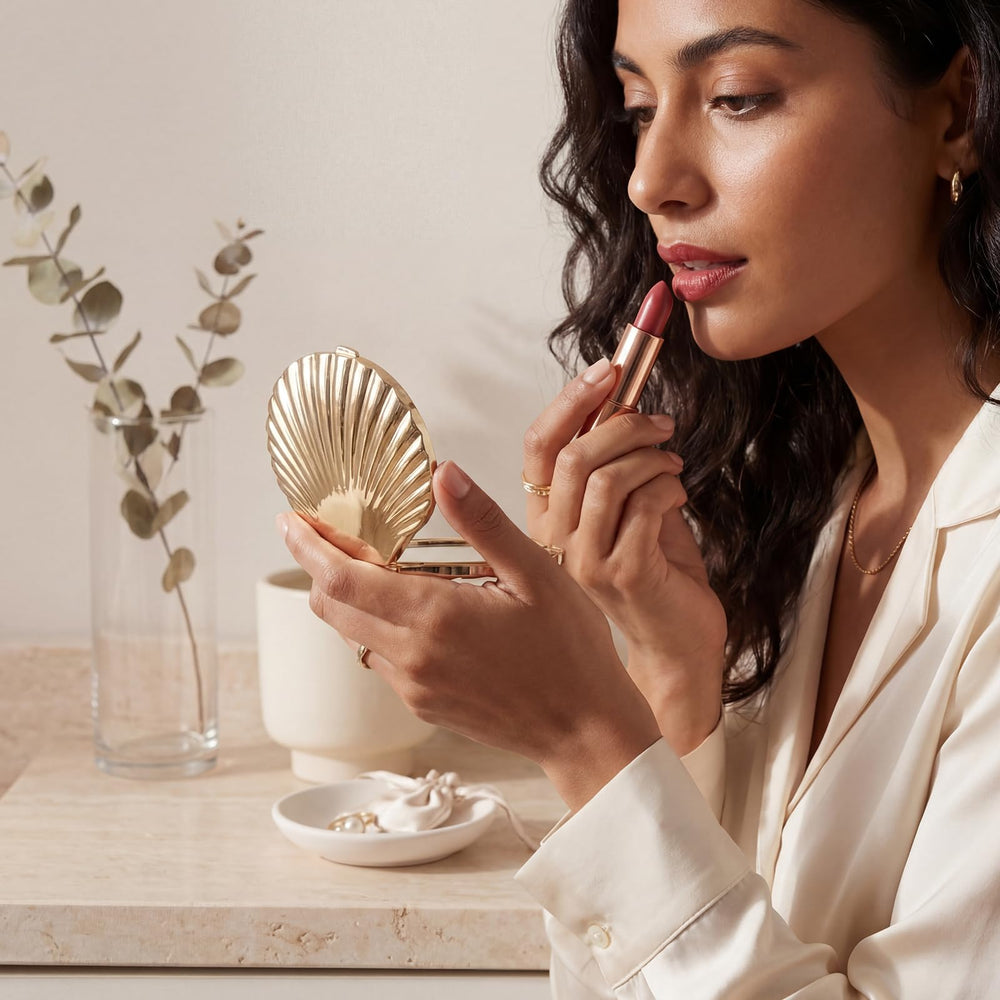 Novabright mirror next to a credit card illustrating 2.7 inch size and travel convenience benefits