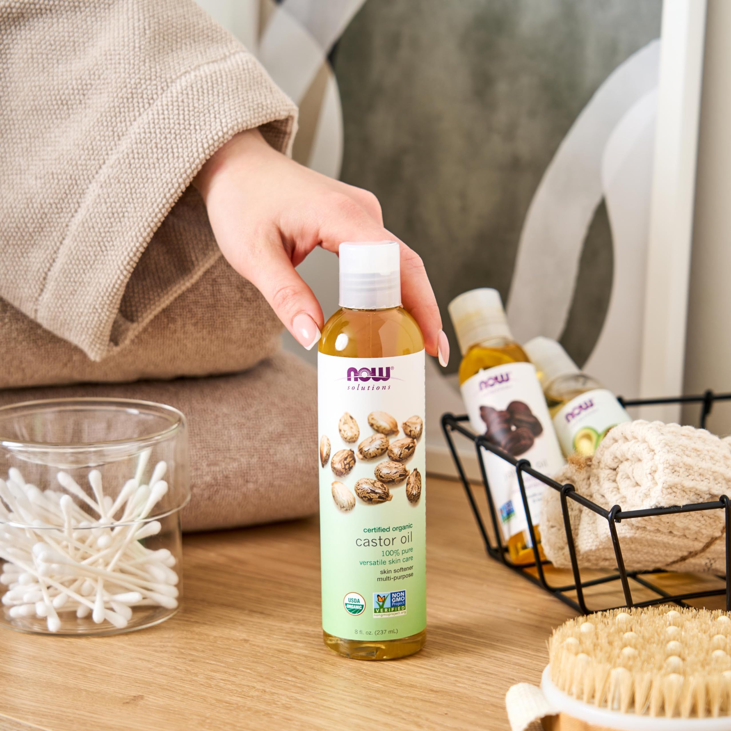 NOW castor oil with castor seeds and leaves showing natural botanical source