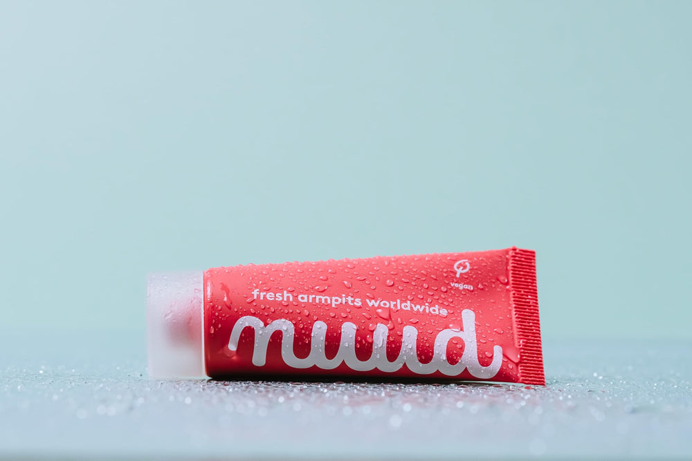 nuud label close-up listing natural ingredients and dermatological approval benefit