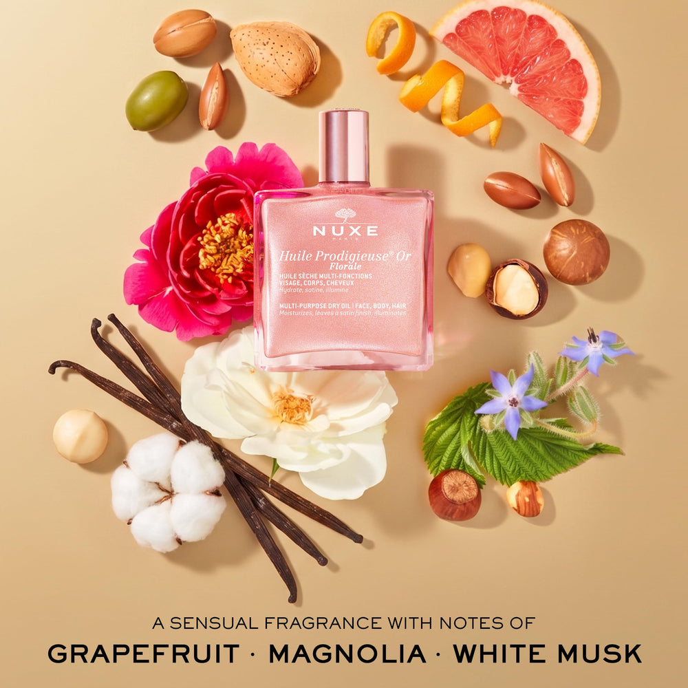 NUXE bottle held in hand to show 1.6 fl oz travel-friendly size