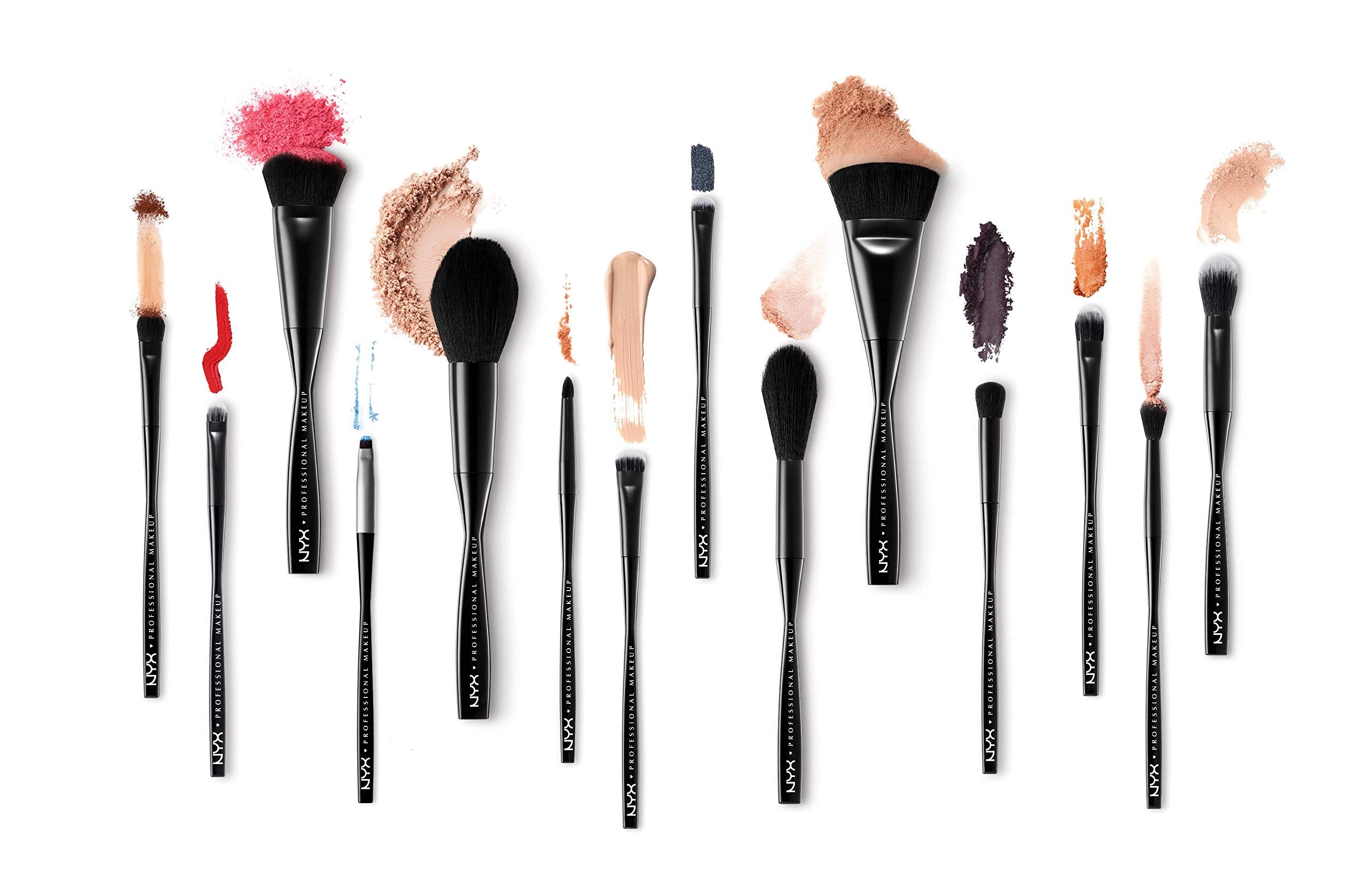 NYX brush held in hand to show size and ergonomic handle for easy control