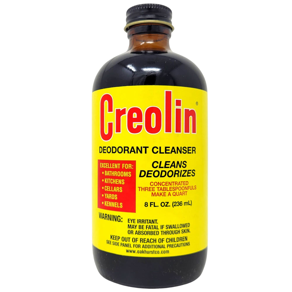 OAKHURST Creolin measuring teaspoon being added demonstrating easy dilution benefit