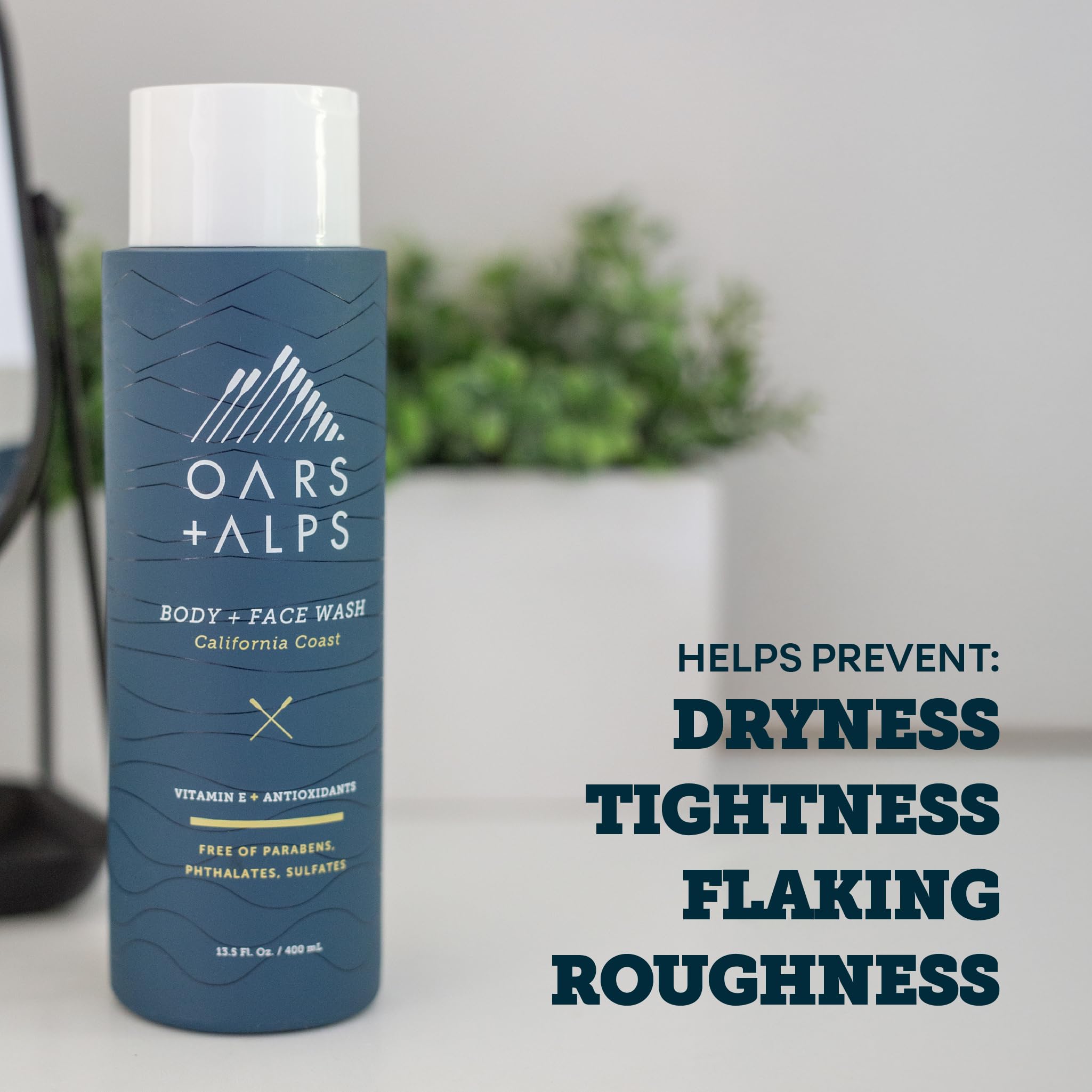 Oars + Alps in-shower lifestyle shot showing a man using the wash