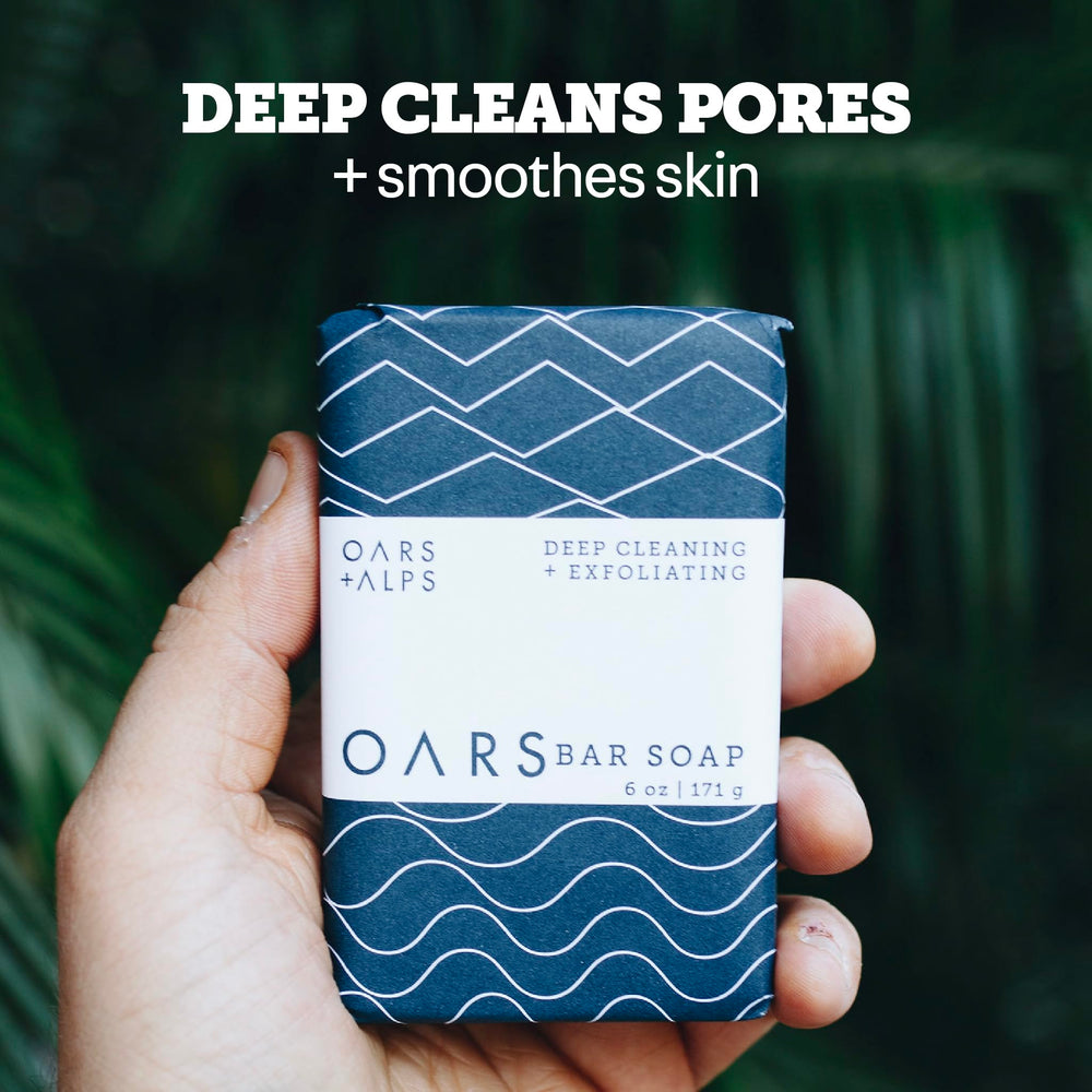 Oars + Alps soap in hand demonstrating travel-friendly size and convenience