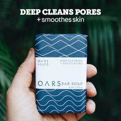 Oars + Alps soap in hand demonstrating travel-friendly size and convenience