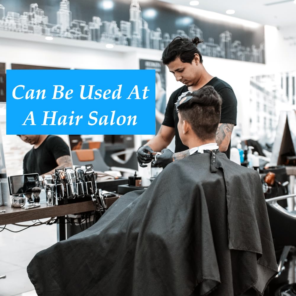 OBTANIM stylist using cape during haircut for tidy, professional service