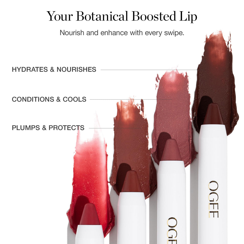 Ogee ROSALIA beside a coin for scale showing compact, travel-friendly lip oil