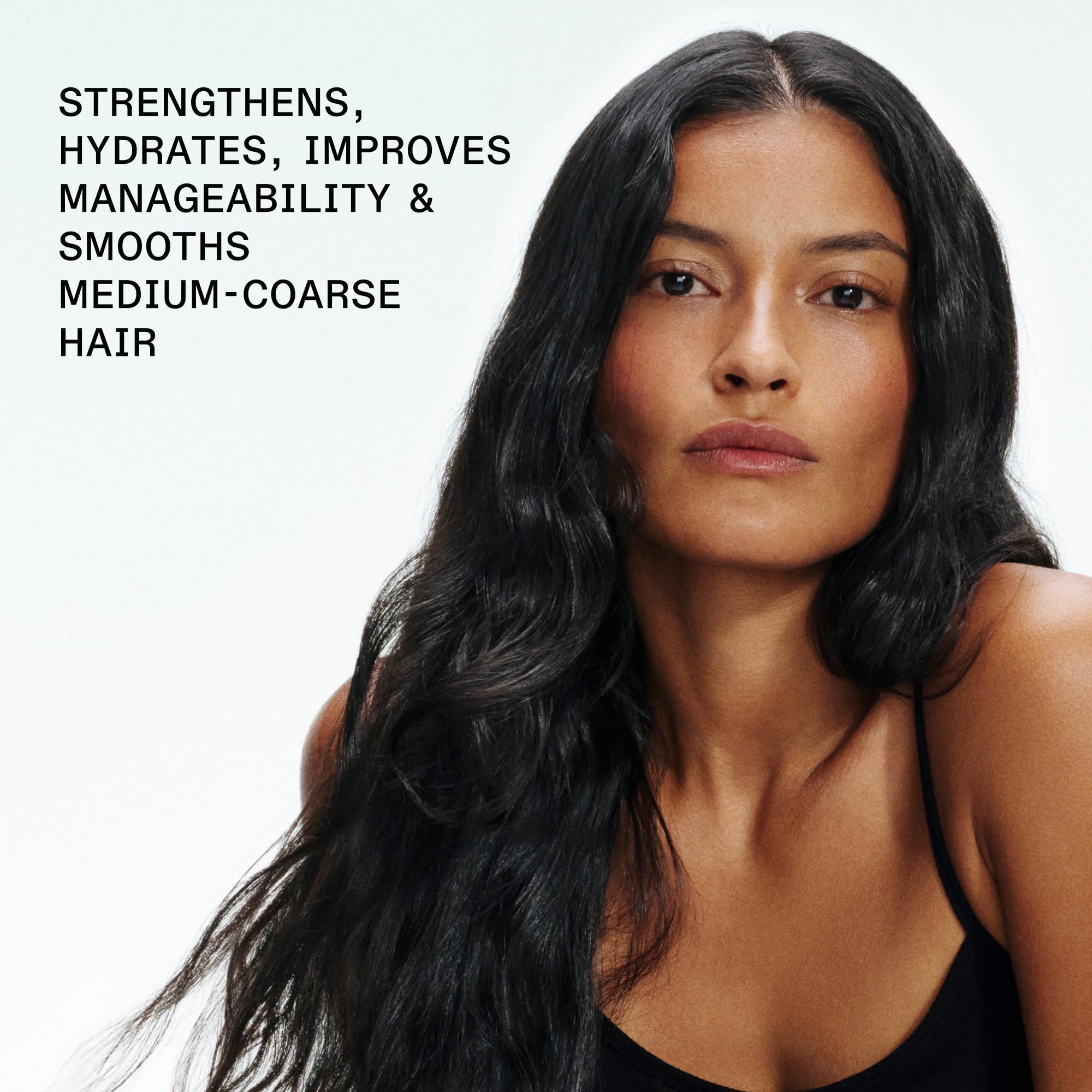 Olaplex applied to mid-lengths in shower demonstrating use