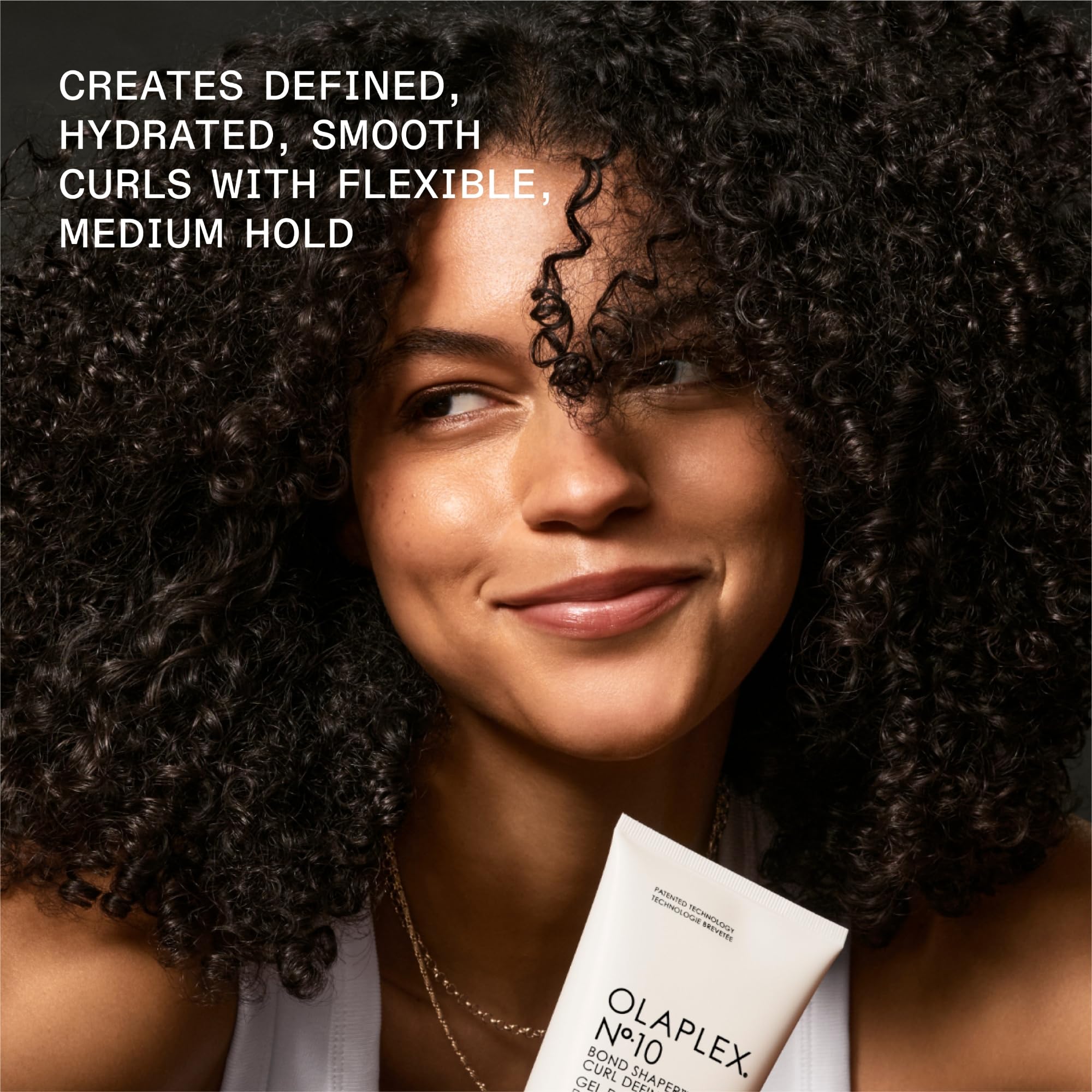 Olaplex No.10 applied to damp curls illustrating enhanced definition and reduced frizz