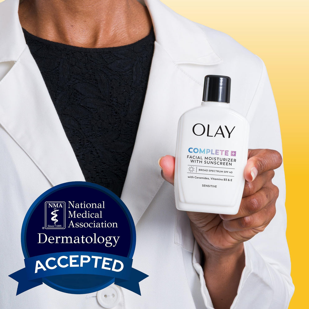 Olay Complete+ being smoothed on cheek demonstrating daily protection benefit