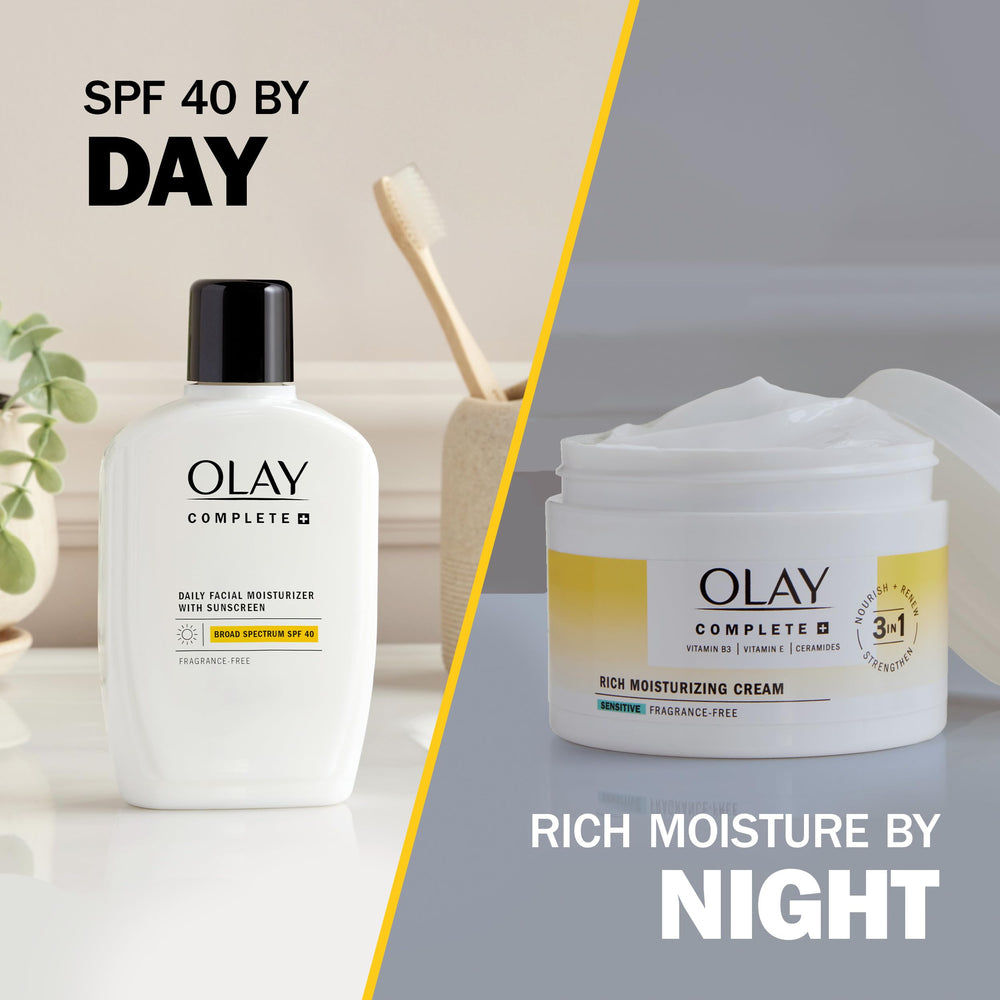 Olay Complete+ jar on nightstand in lifestyle scene for daily skincare routine