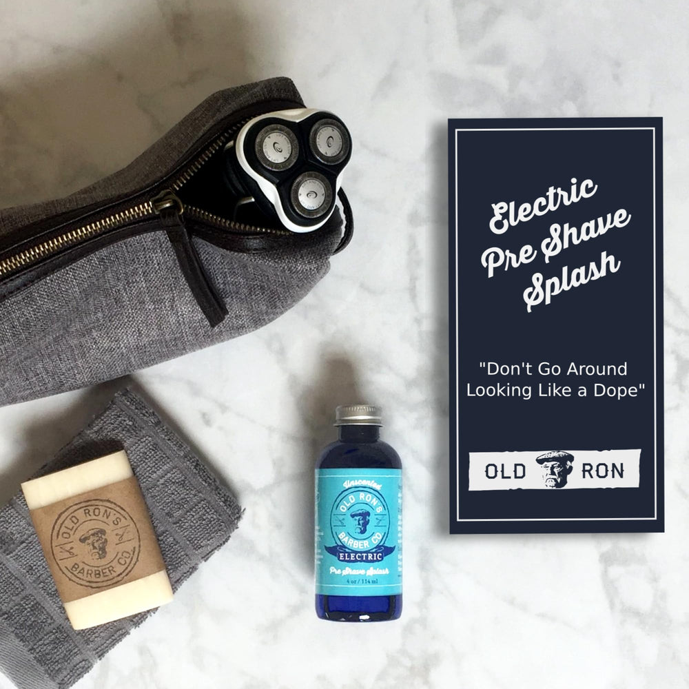 Old Ron's applied at bathroom mirror to prepare for electric shave