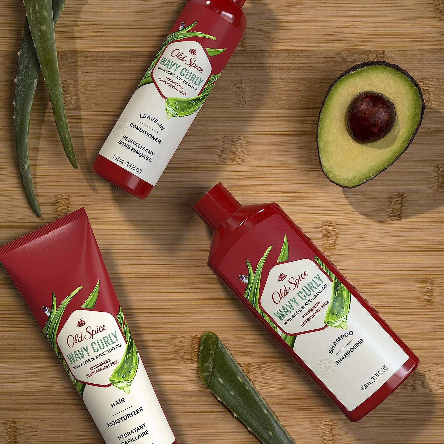 Old Spice leave-in conditioner applied to damp hair for frizz control