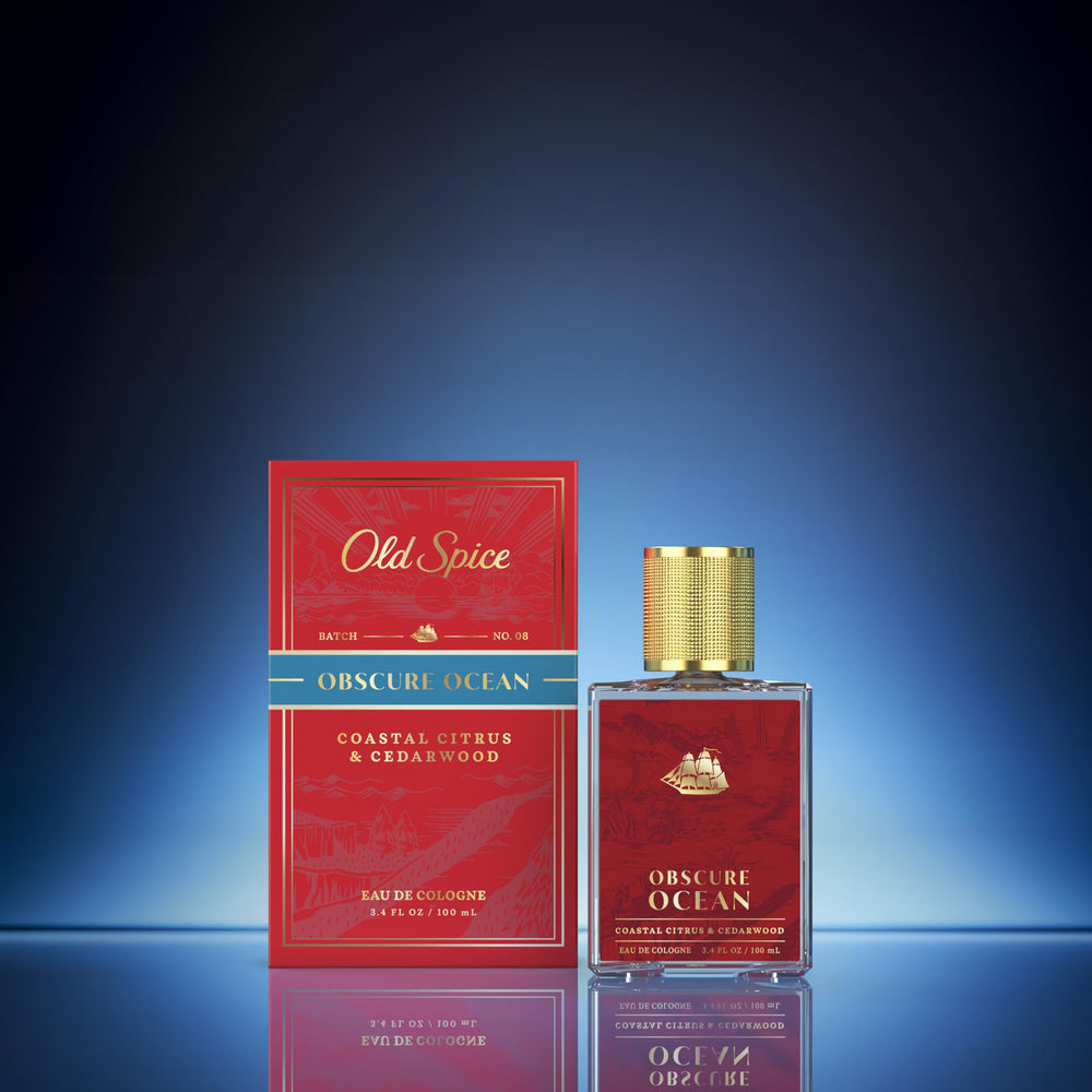 Old Spice bottle in hand showing 3.4 fl oz scale for travel convenience