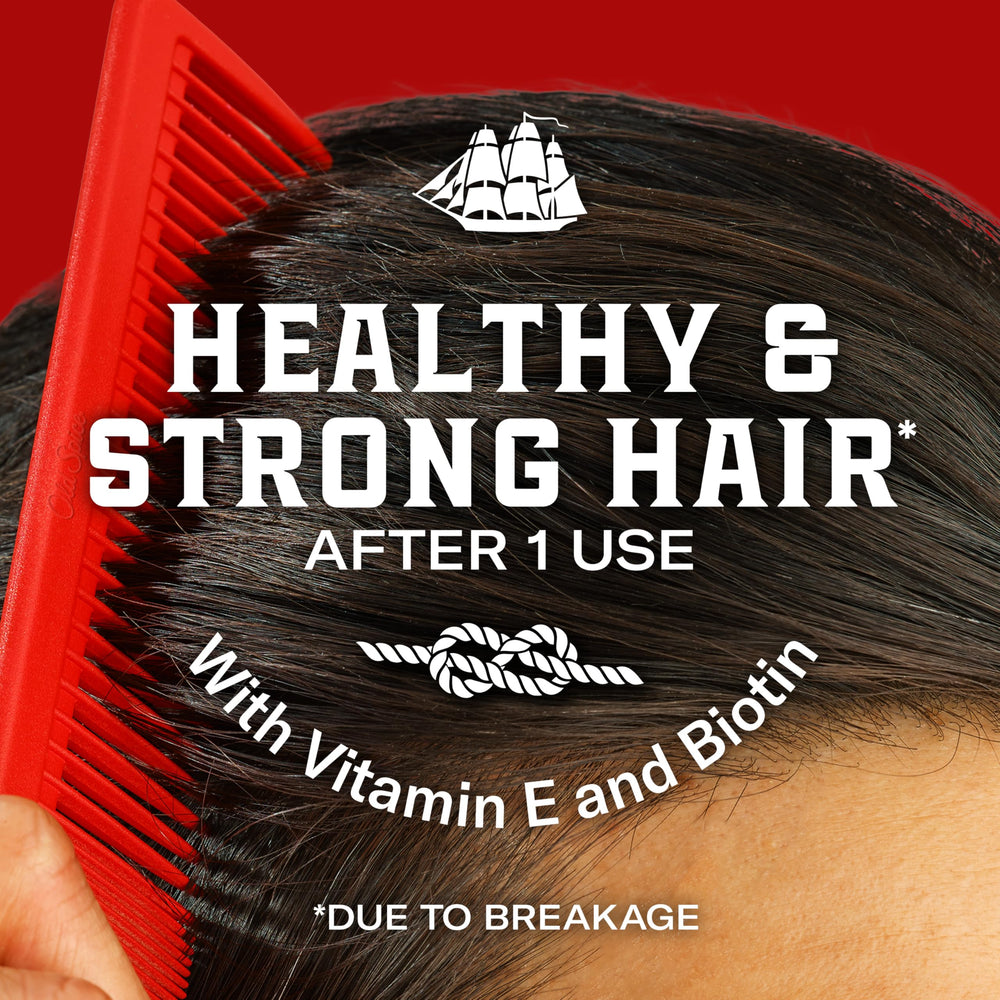 Old Spice being worked through damp hair for even distribution and natural styling