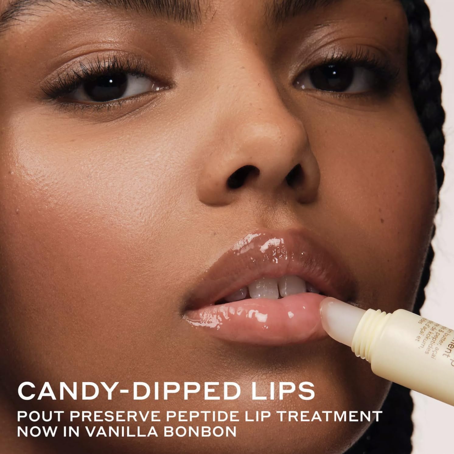Ole Henriksen texture close-up of creamy lip treatment, showing glossy finish and moisturizing benefit