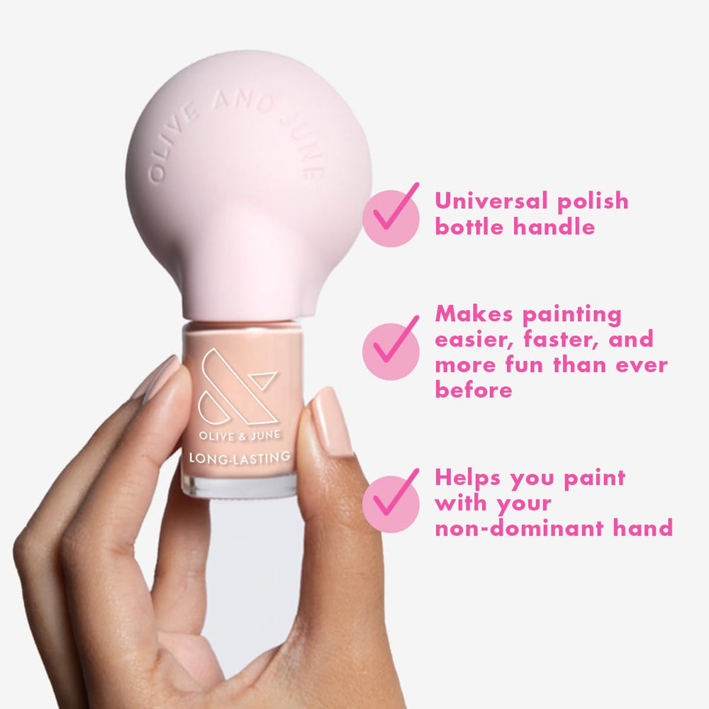 Olive & June Poppy in use in dominant hand delivering smoother brush application benefit