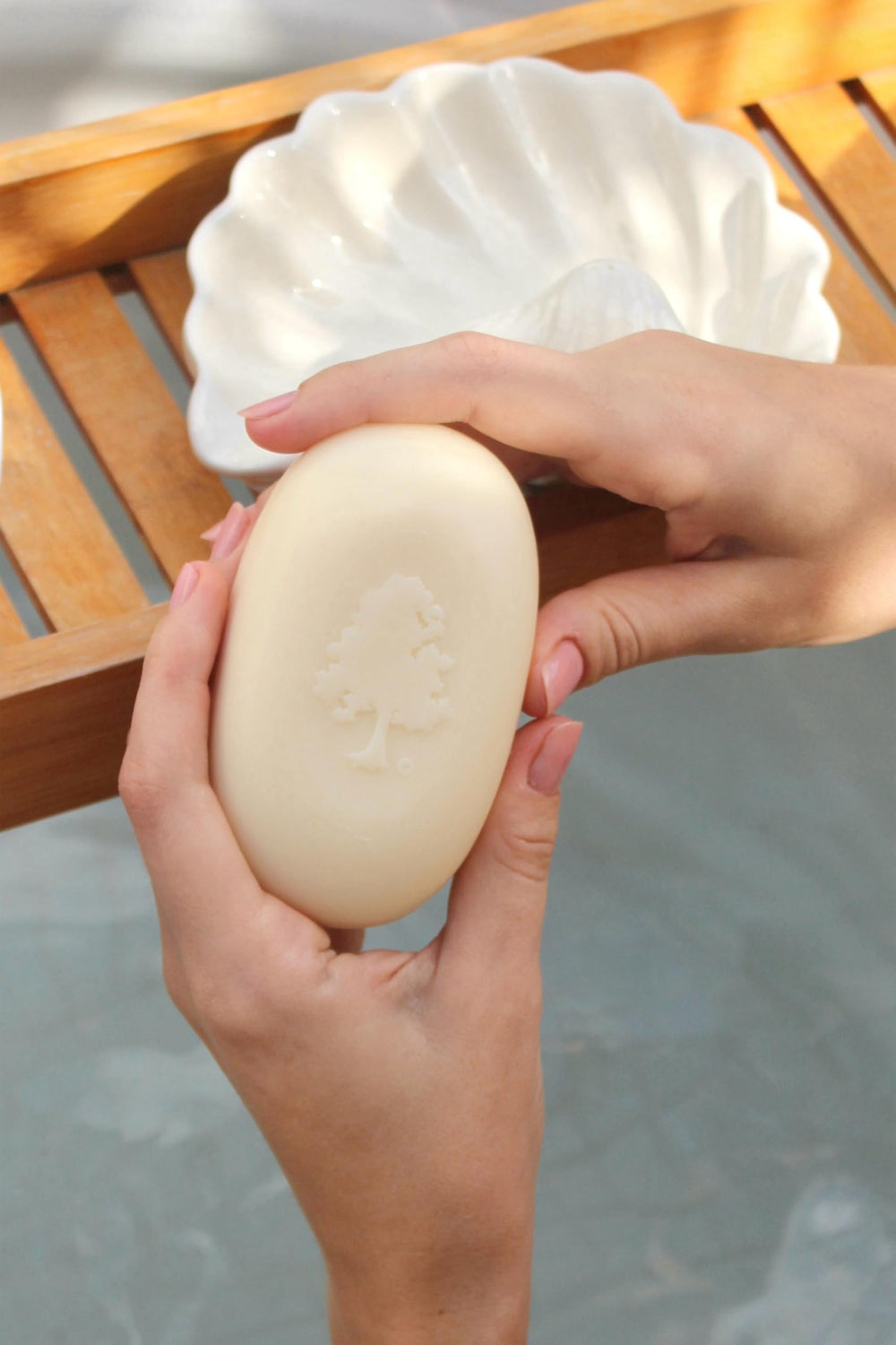 Close-up of Olivia Care soap bar texture showing creamy triple-milled surface benefit