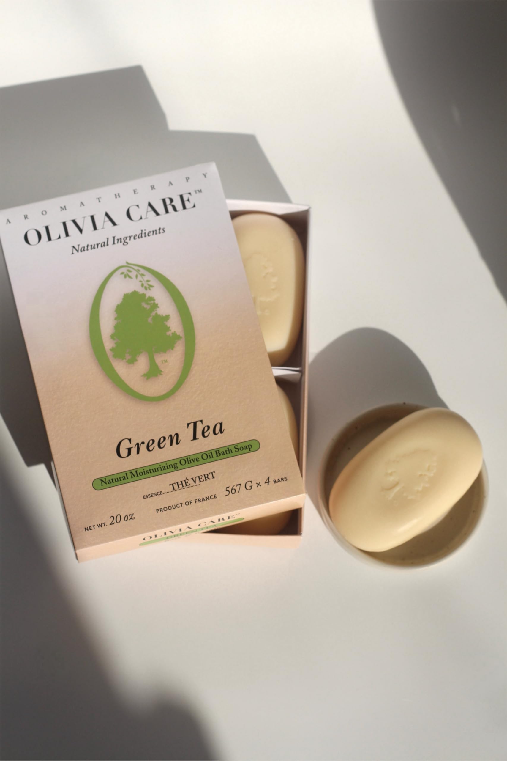 Olivia Care soap next to a ruler for scale, showing the 5 oz oval bar size